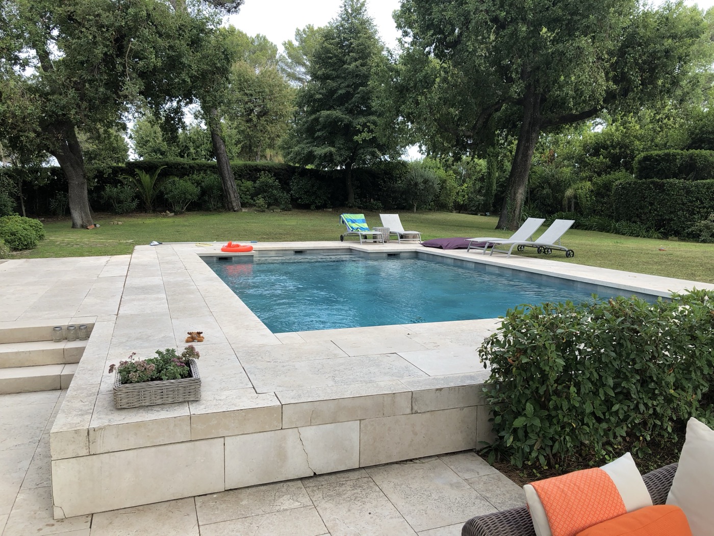 Weekly pool service performed by an H2Oasis technician at a backyard pool in Clermont, FL