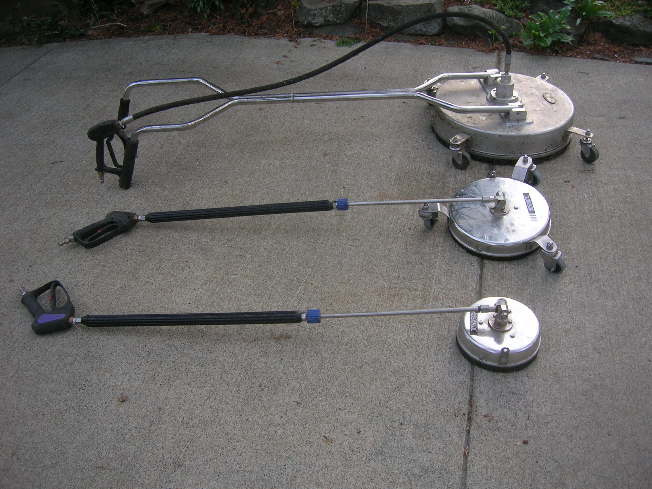 Rotary surface cleaner attachments laid out