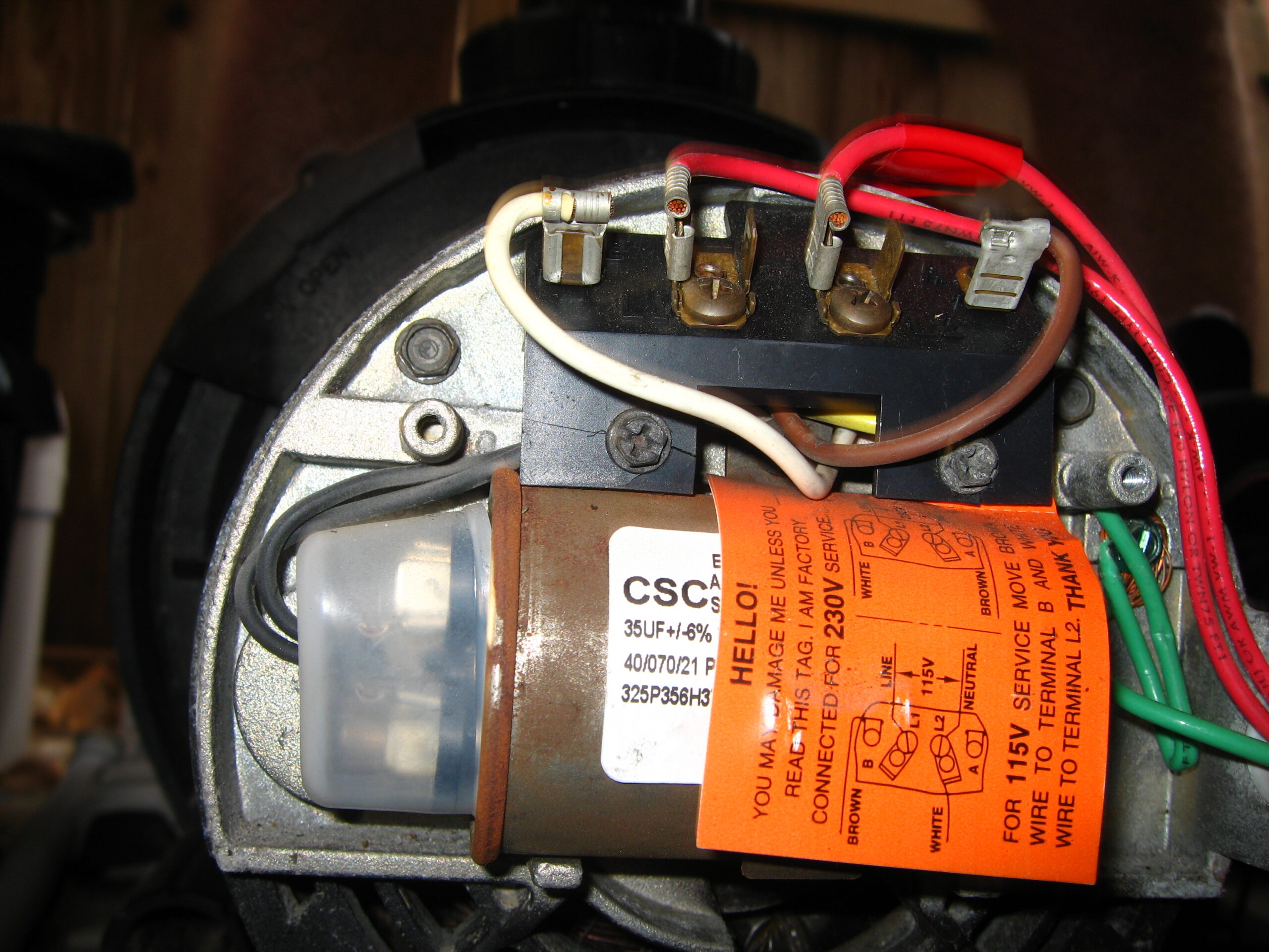 Close view of a pool pump motor being serviced