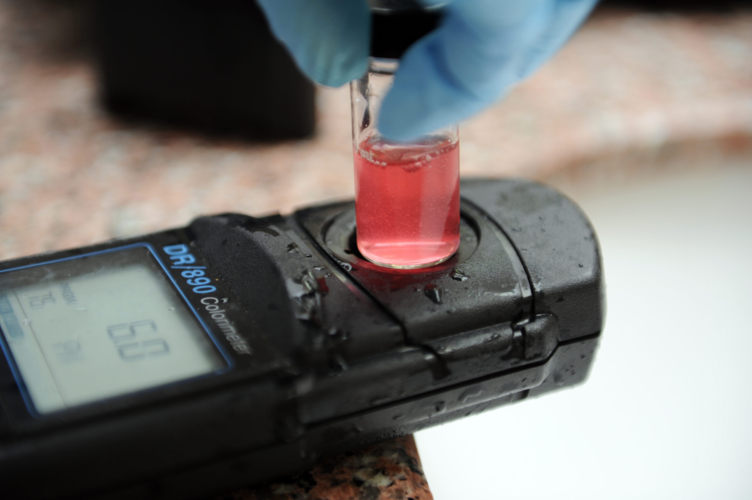 Pool water sample being tested for chlorine